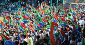 South Africa Fans cheer their nation from cricket stadium with their flag